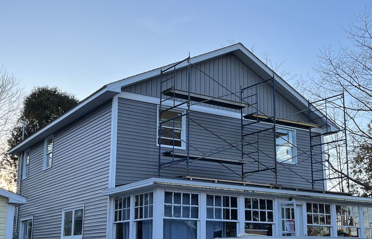 Finished second-storey addition with new siding
