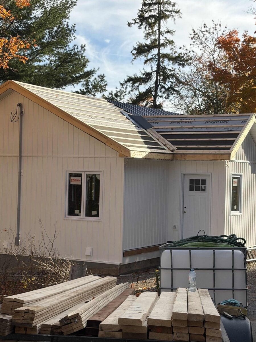 The rebuild with new siding and roof underway