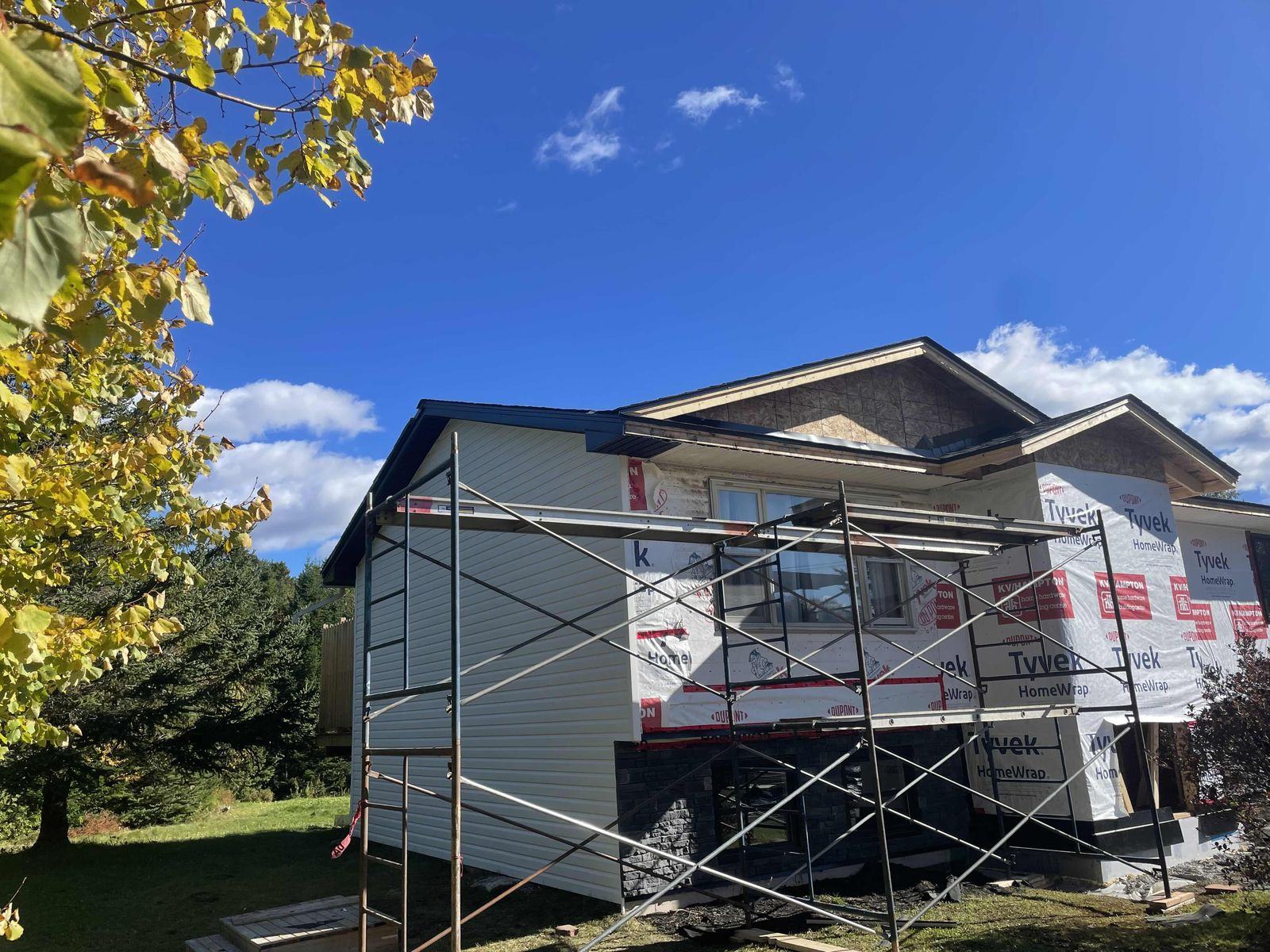 Addition and exterior renovation underway with scaffolding