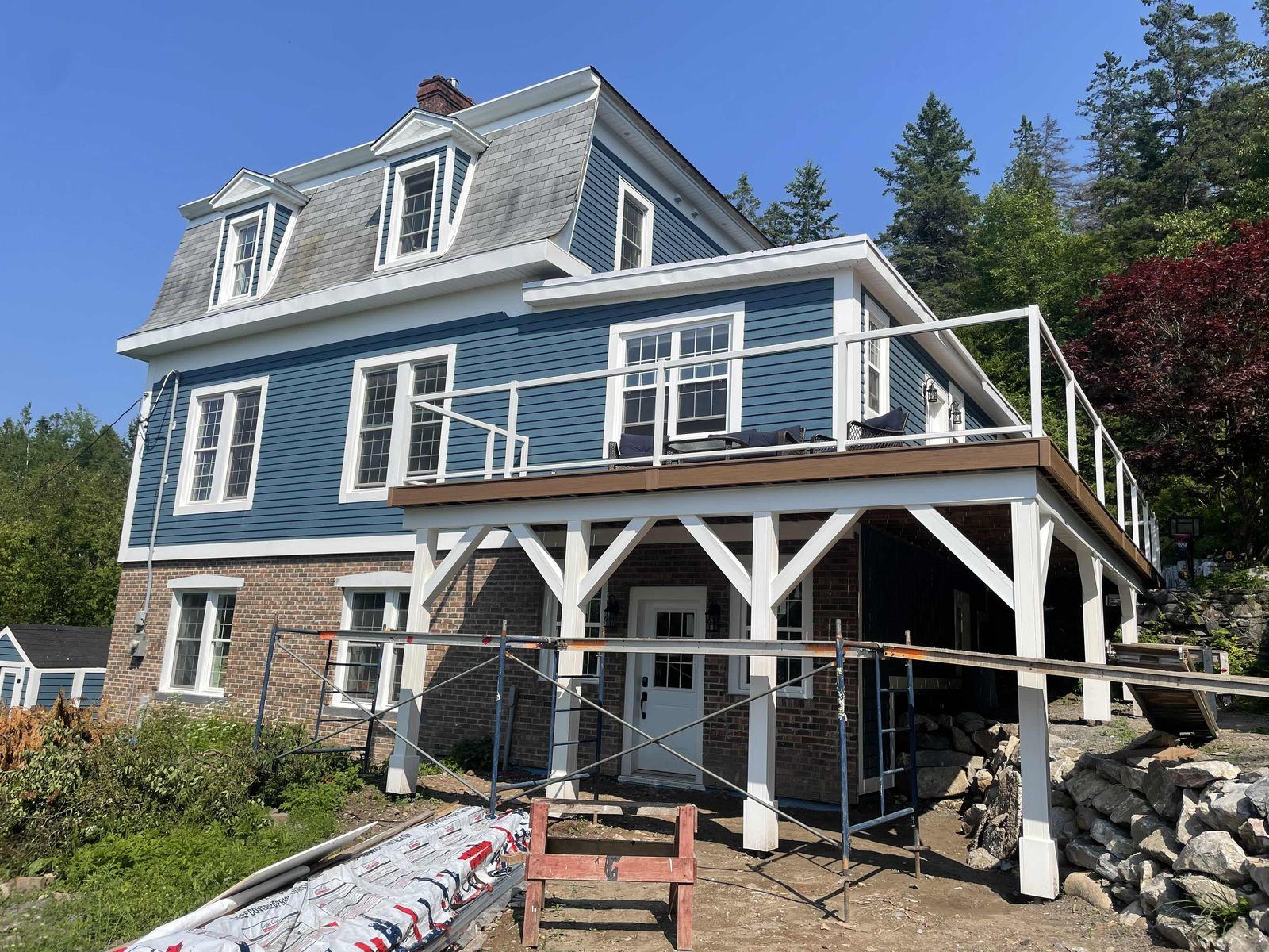The addition, deck and new cedar siding