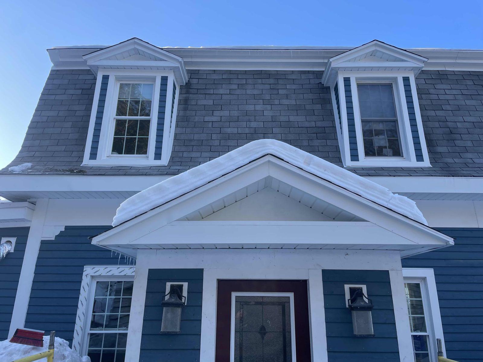 Front entry trim matched to the original home