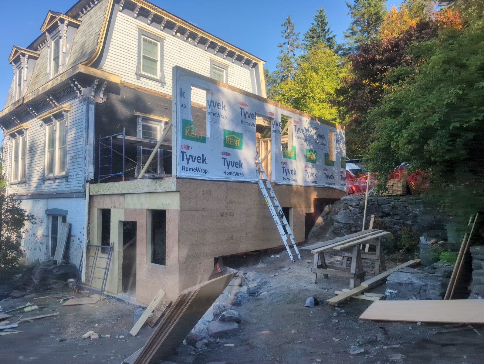 Addition framed and wrapped on the hillside