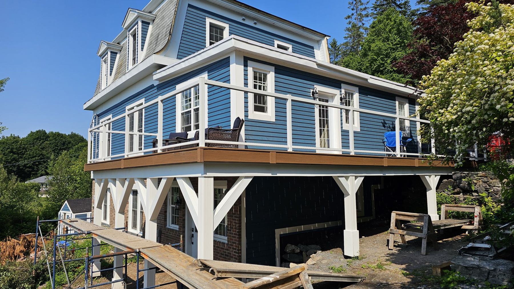 Finished two-storey addition with new deck on a 150-year-old home