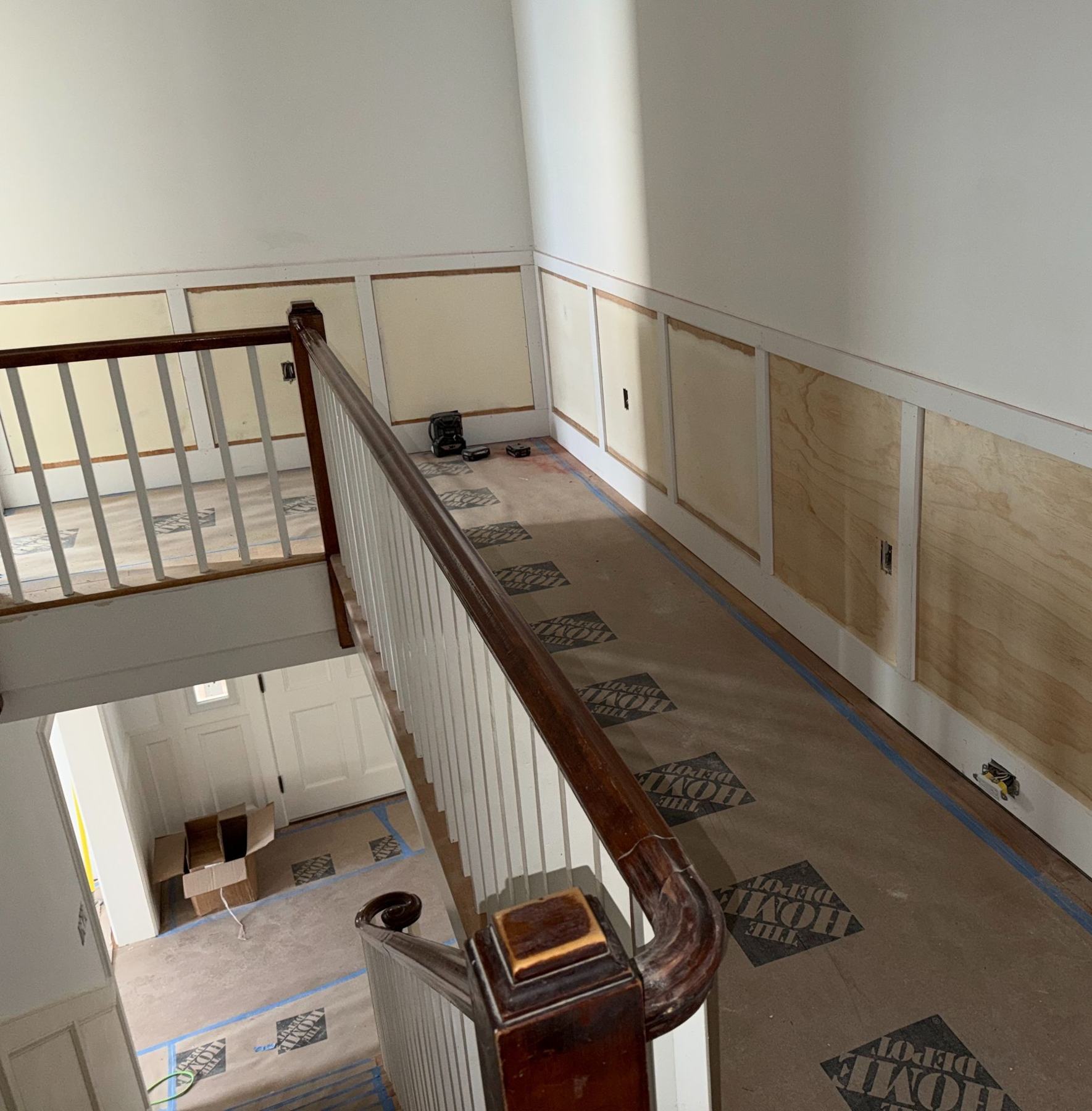 Renovated upper hallway with new wainscoting and stair railing